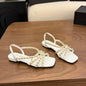 Chanel Interwoven Chain Flat Slingback Sandals in white.