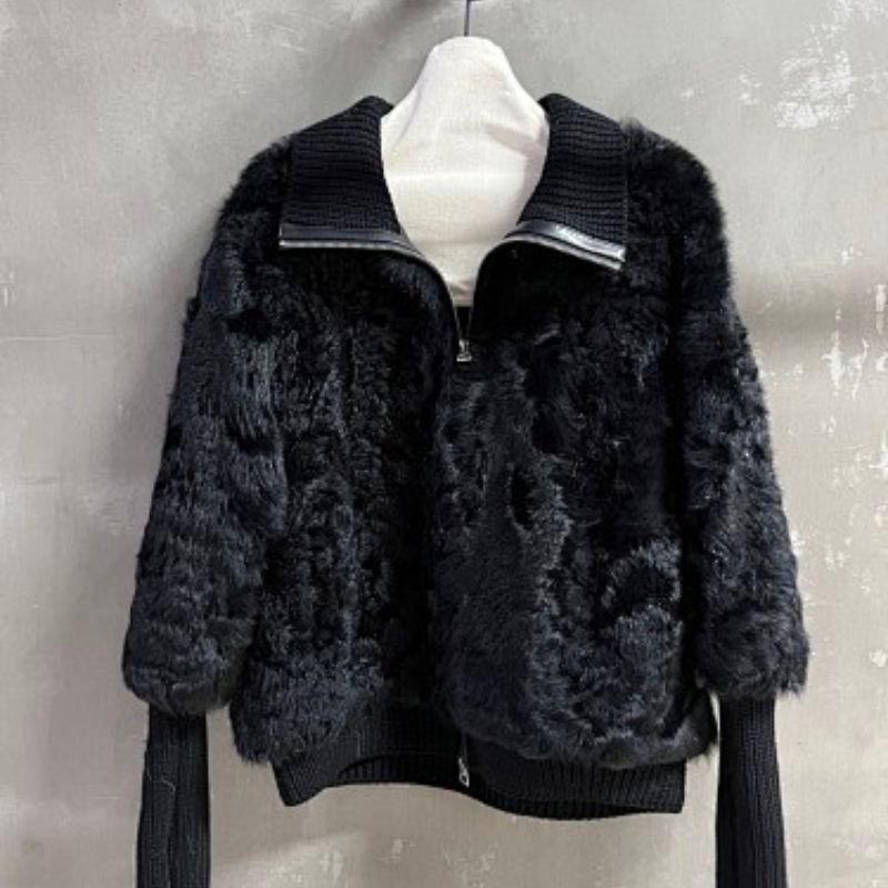 Christian Dior  faux-fur jacket featuring contrasting black knit sleeves, collar, and hem