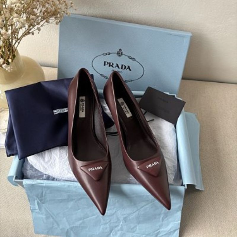 Prada 75mm Padded Triangle-Logo Leather Pumps.
