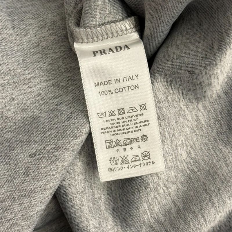 Prada gray two-piece set consisting of a cropped hoodie and matching sweatpants.