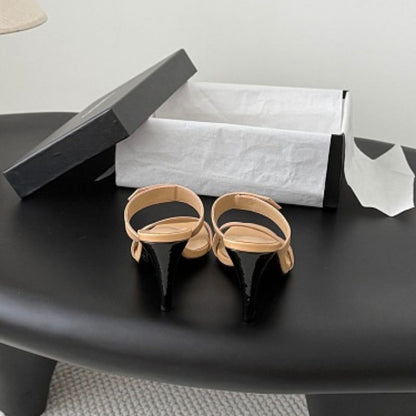 Chanel Crinkled Calfskin Double-Strap Mules in beige.