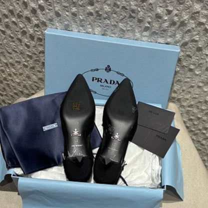 Prada Asymmetric Canvas Strap Buckle Pumps.
