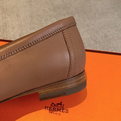 Hermès Royal Loafers in a bi-color tan and white leather combination.