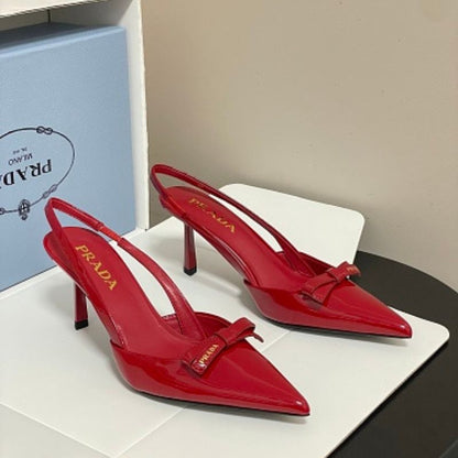 Prada Vernice Patent Leather Bow Slingback Pumps.