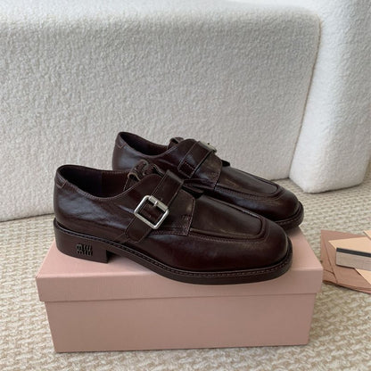 Miu Miu Buffalo Leather Buckle Loafers.