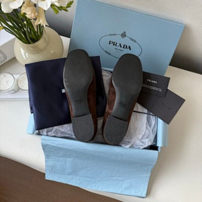 Prada Suede Driver Loafers in a rich chocolate brown ("Moro") colorway.