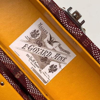 Goyard Cassette Trunk Bag in the rich burgundy