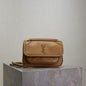 Saint Laurent Niki Flap Bag in a tan or brown pebbled leather