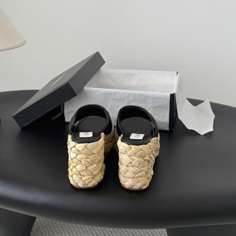 Chanel Quilted Interlocking CC Straw Platform Mules in black (noir).