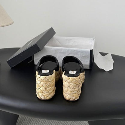 Chanel Quilted Interlocking CC Straw Platform Mules in black (noir).