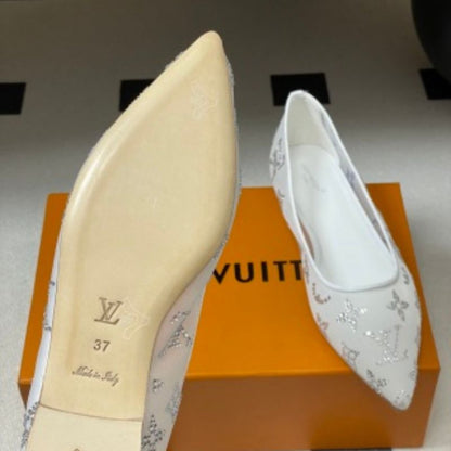 Louis Vuitton Gala Flat Ballerinas in white.