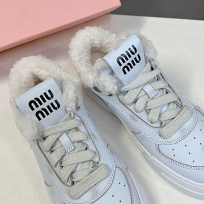 Miu Miu Shearling-Lined Sneakers.