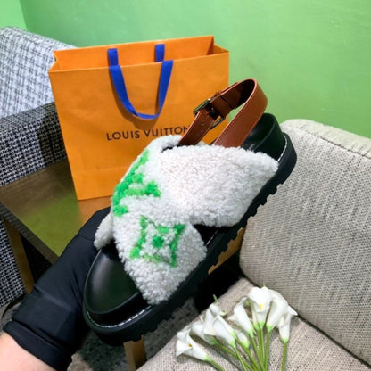 Louis Vuitton Paseo Flat Comfort Sandal with a green logo in shearling