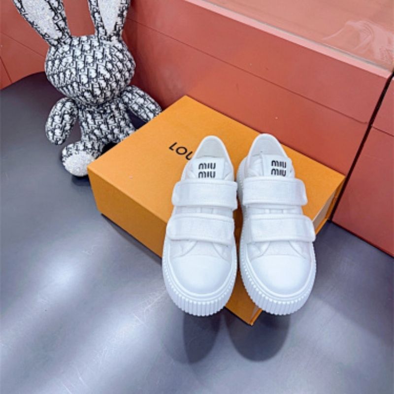 Miu Miu "Denim" sneakers with a thick, ribbed platform sole