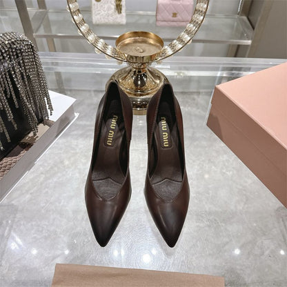 Miu Miu waxed calfskin pointy toe pumps.