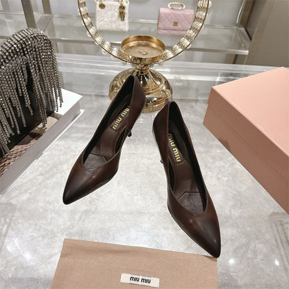 Miu Miu waxed calfskin pointy toe pumps.