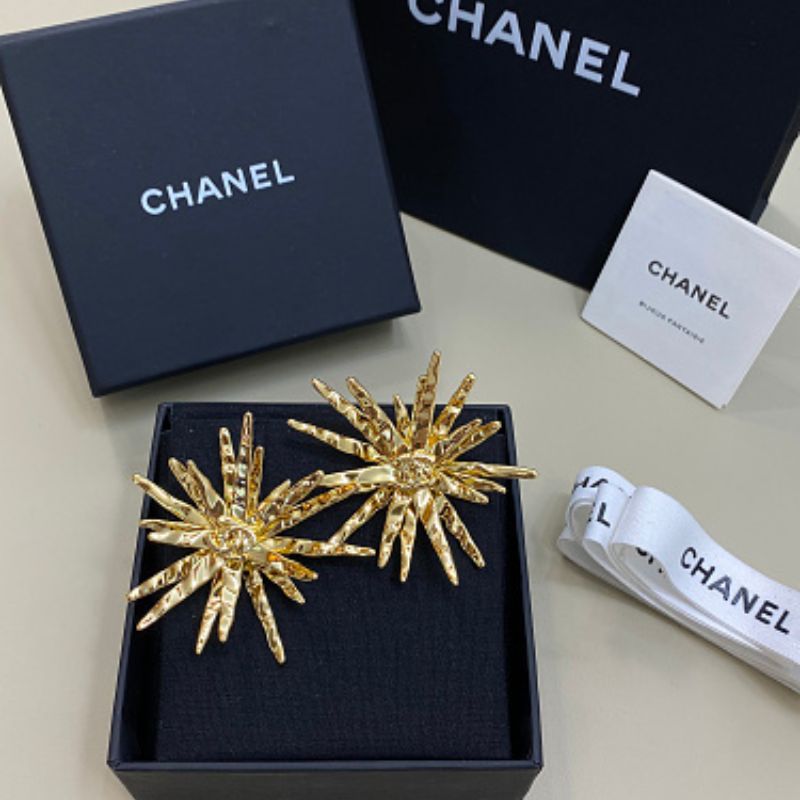 Chanel textured sunburst statement earrings
