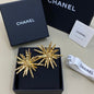 Chanel textured sunburst statement earrings