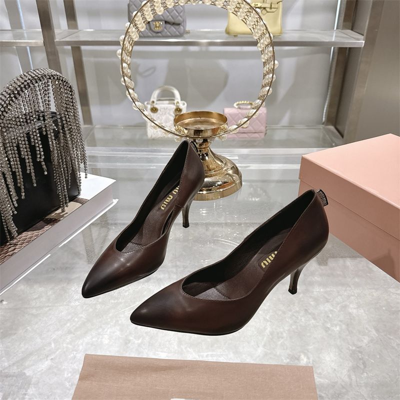 Miu Miu waxed calfskin pointy toe pumps.