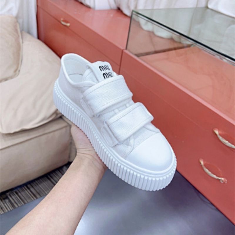 Miu Miu "Denim" sneakers with a thick, ribbed platform sole