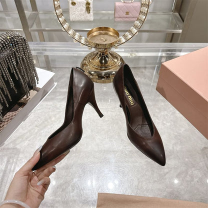 Miu Miu waxed calfskin pointy toe pumps.