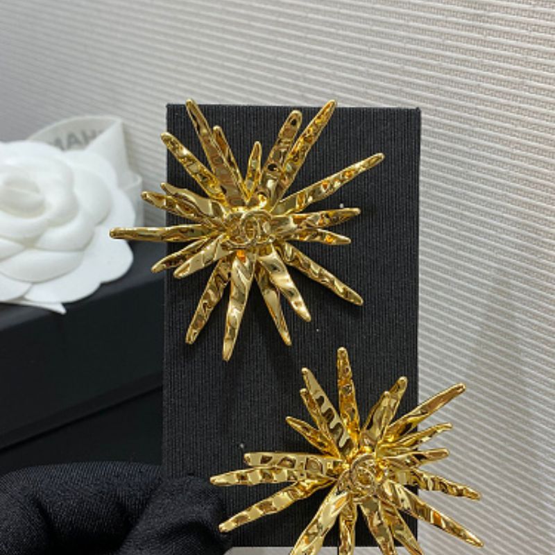Chanel textured sunburst statement earrings