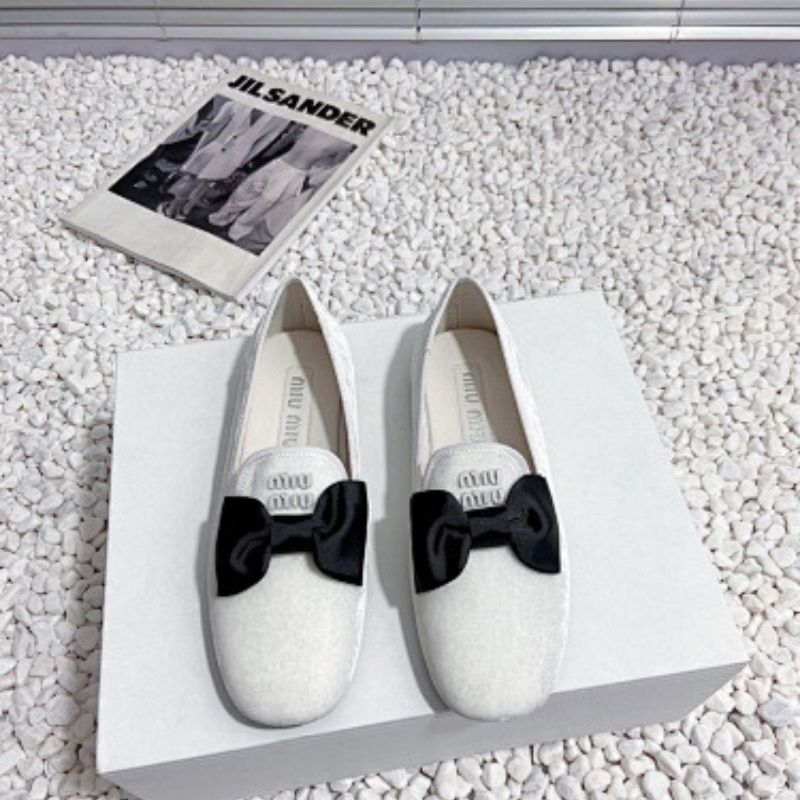 Miu Miu Bow Loafers.