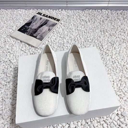 Miu Miu Bow Loafers.