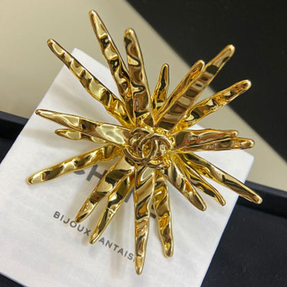 Chanel textured sunburst statement earrings