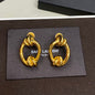 Saint Laurent Knotted Doorknocker Earrings