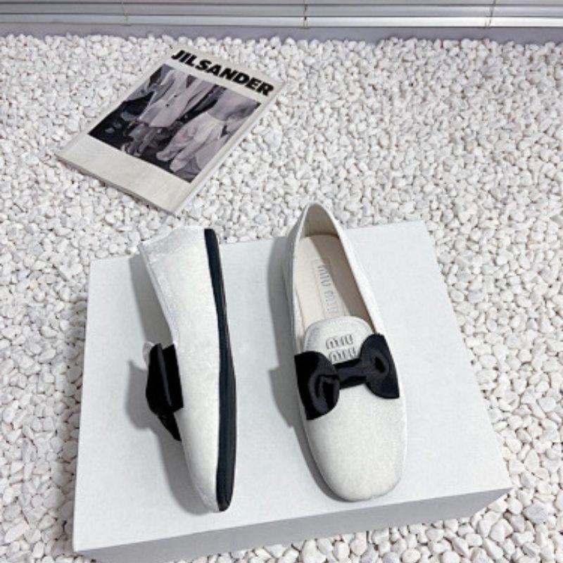 Miu Miu Bow Loafers.