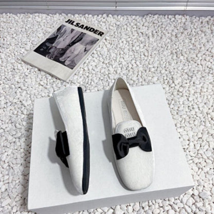 Miu Miu Bow Loafers.