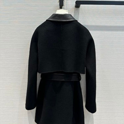 Hermès black wool coat leather collar and a belted waist.