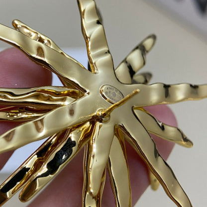 Chanel textured sunburst statement earrings