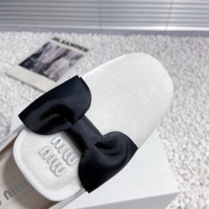 Miu Miu Bow Loafers.