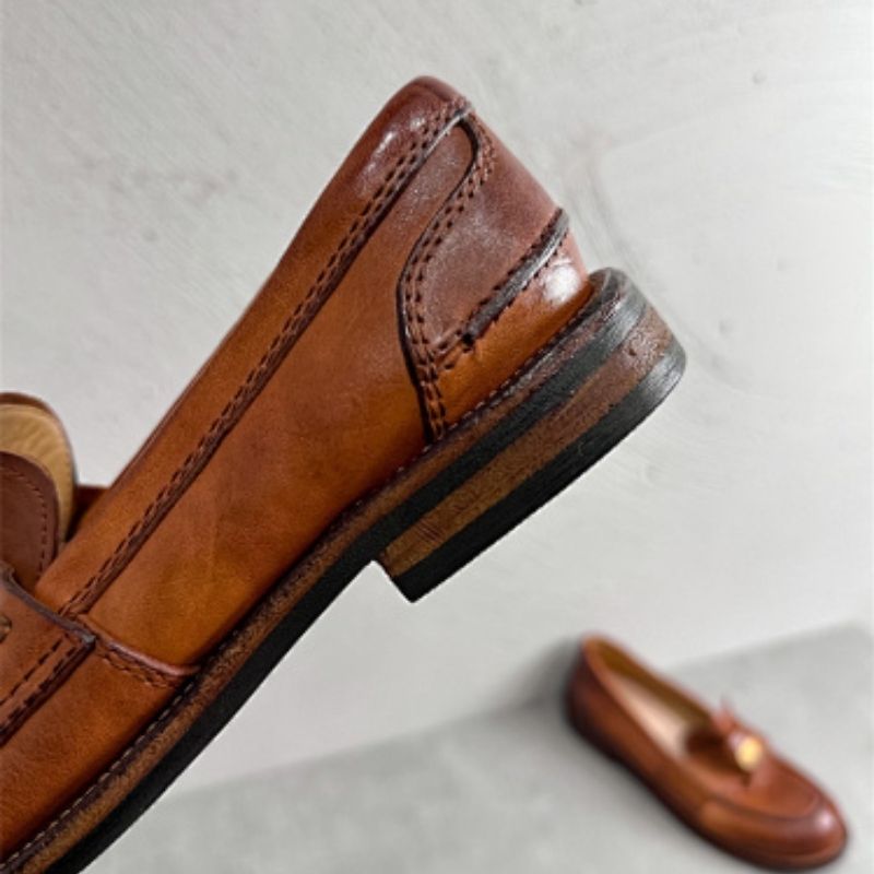 Miu miu brown leather loafers with gold-tone hardware detail,