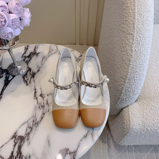 Miu Miu Mary Jane flats.