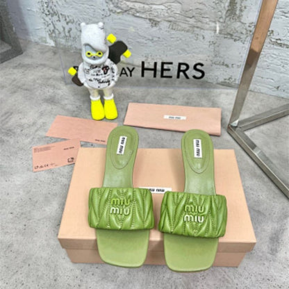 Miu Miu "Matelassé" leather slides in a green