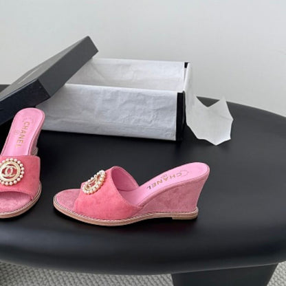 Chanel Pearl-Embellished Interlocking CC Suede Mules in bright pink.