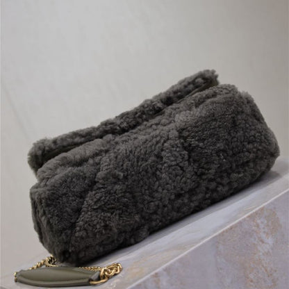 Saint Laurent Jamie Puffer Flap Bag in shearling.