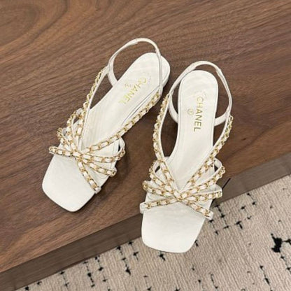 Chanel Interwoven Chain Flat Slingback Sandals in white.