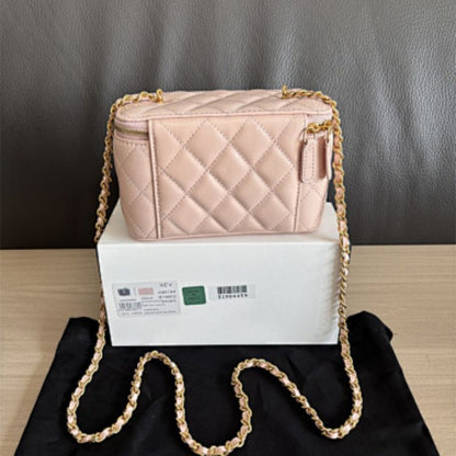 Chanel Small Classic Quilted Vanity Case in a light pink hue.