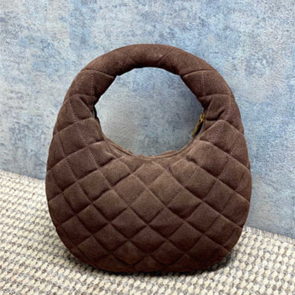 Saint Laurent Icarino a rounded top-handle bag .