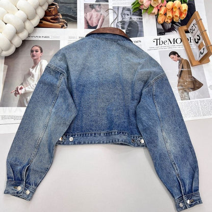 Prada cropped denim jacket with a brown leather collar.