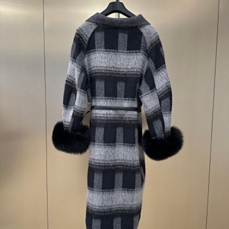 Christian Dior coat with black fur cuffs.