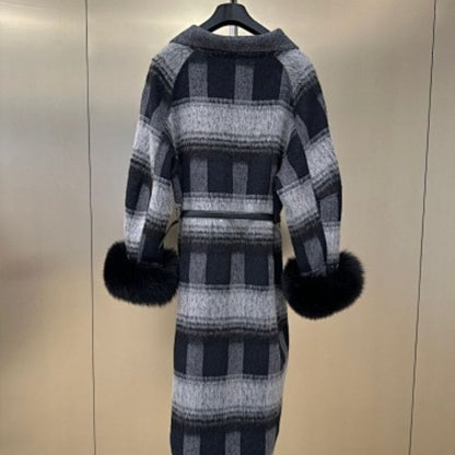 Christian Dior coat with black fur cuffs.