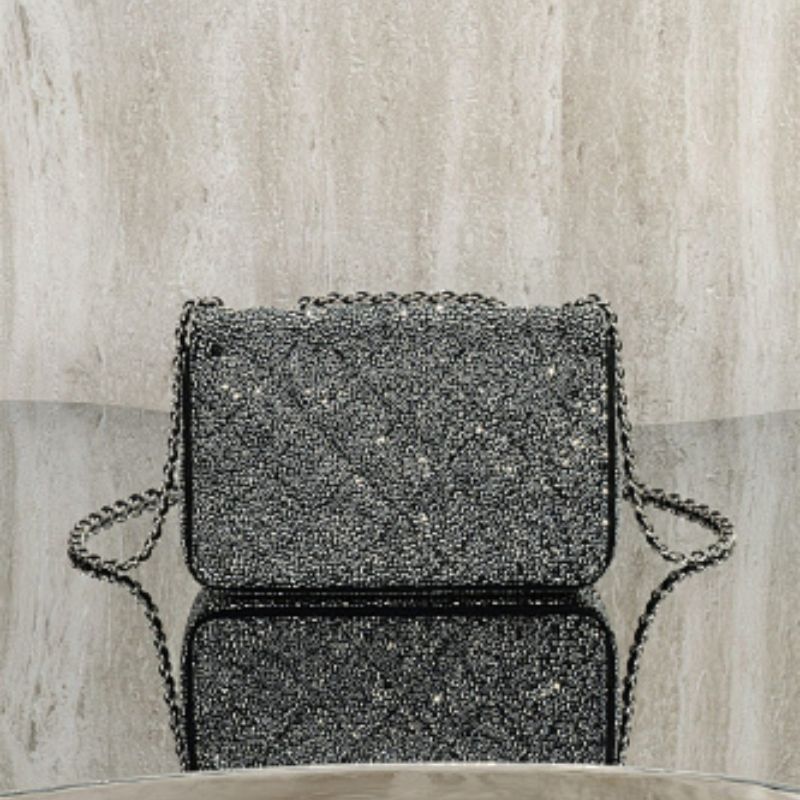 Chanel Rectangular Mini Flap Bag in black glitter.