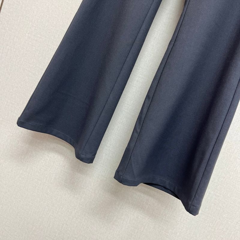 Prada layered trousers with a wrap-around skirt overlay.