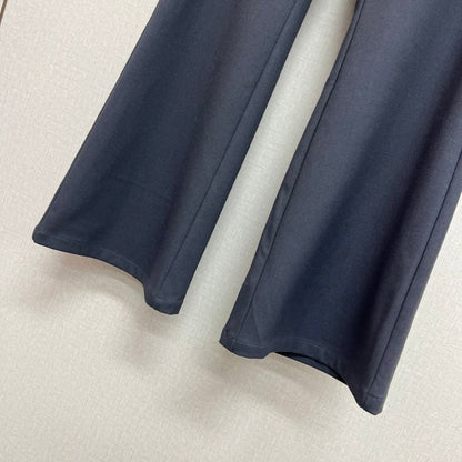 Prada layered trousers with a wrap-around skirt overlay.