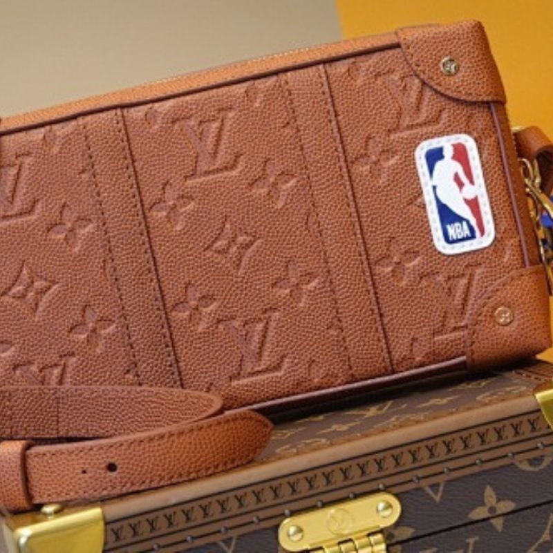 Louis Vuitton x NBA Soft Trunk Wearable Wallet in Ball Grain Leather.